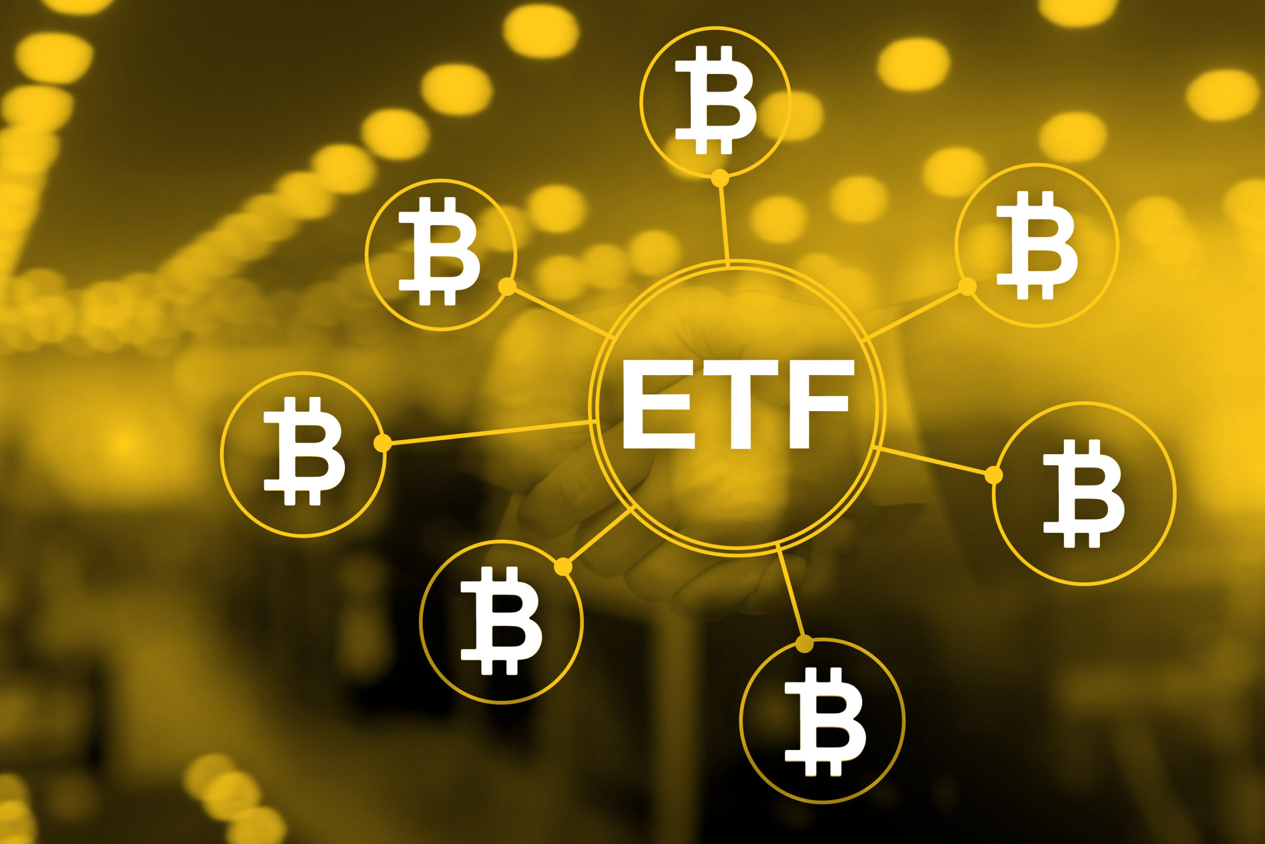 ETF in the middle of Bitcoin Symbols with yellow and black background