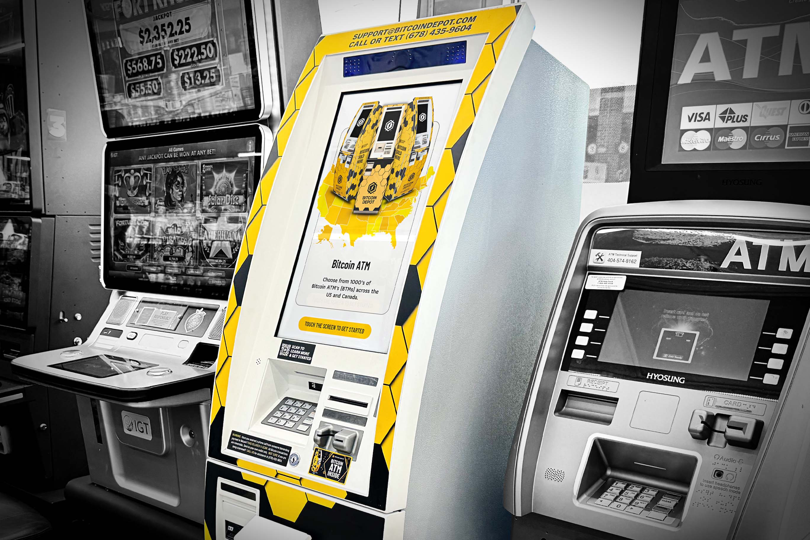 A brightly colored Bitcoin Depot ATM stands between two black-and-white traditional ATMs or gaming kiosks.