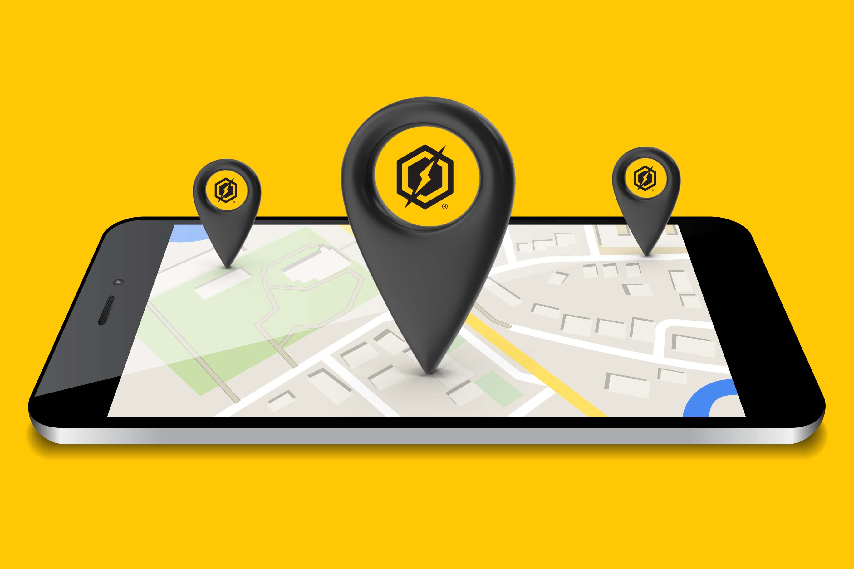 A digital illustration of a smartphone lying flat, displaying a street map on its screen. Three large, black, 3D-style location pins hover above the map, each featuring a yellow circular logo containing a hexagon and a lightning bolt. The phone is set against a solid, vibrant yellow background.